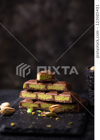 Dubai chocolate with kadayif pistachio filling Dubai chocolate with kadayif pistachio filling 123085491
