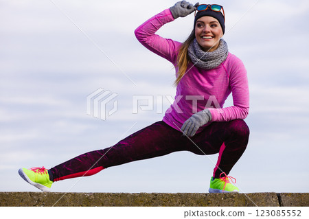 Woman fitness sport girl training outdoor in cold weather 123085552