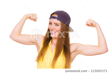 Woman casual style showing off muscles biceps 123085571