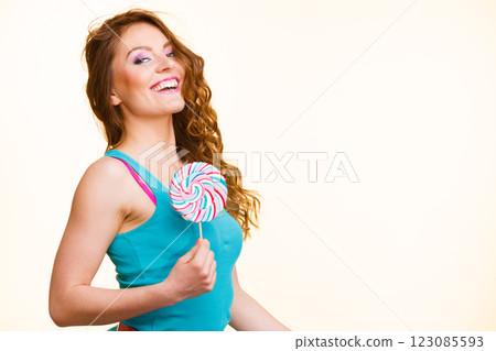 Woman joyful girl with lollipop candy 123085593