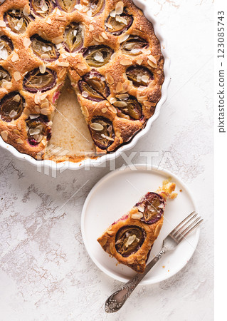 Traditional American plum pie on white table. Traditional American plum pie on white table. 123085743