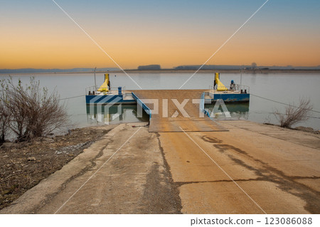 River Danube banks and empty ferry terminal pier in Romania. 123086088