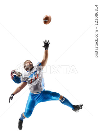 Athlete in a jump. American football. Player catches the ball and flies in the air. Sport emotion. Sportsman in action. Isolated on white background 123086814