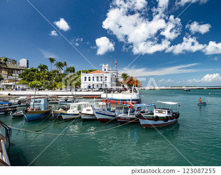 Colorful fishing boats moored in the Port of Salvador, with capitania dos portos in the background 123087255