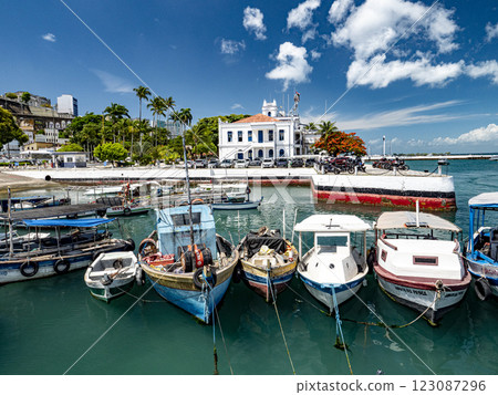 Colorful fishing boats moored in the Port of Salvador, with capitania dos portos in the background 123087296