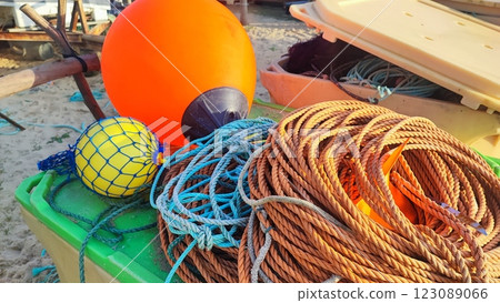Fishing equipment, boats, nets on the Atlantic coast in Portugal. Fishing trash on the ocean beach. Fishing equipment, boats, nets on the Atlantic coast in Portugal. Fishing trash on the ocean beach. 123089066
