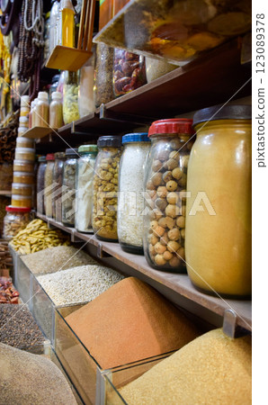 Bottled spices like curry and turmeric displayed in bazaar market in Marrakesh 123089378
