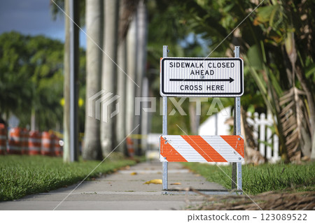 Warning sign that sidewalk is closed at street construction site. Utility work ahead 123089522