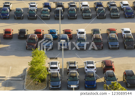 View from above of dealers outdoor parking lot with many brand new cars in stock for sale. Concept of development of american automotive industry 123089544