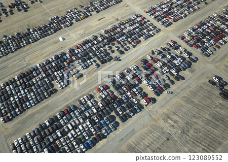 View from above of big parking lot with parked used cars after accident ready for sale. Auction reseller company selling secondhand broken vehicles for repair View from above of big parking lot with parked used cars after accident ready for sale. Auction reseller company selling secondhand broken vehicles for repair 123089552