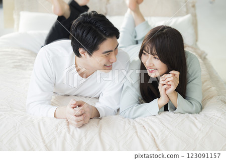 A couple sleeping in bed A couple sleeping in bed 123091157