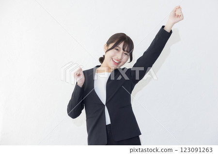 Smiling woman standing against white background 123091263