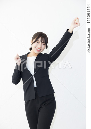 Smiling woman standing against white background Smiling woman standing against white background 123091264