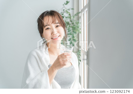 Asian woman drinking water, hot water, mineral water (hydration) Asian woman drinking water, hot water, mineral water (hydration) 123092174
