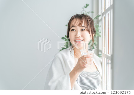 Asian woman drinking water, hot water, mineral water (hydration) 123092175