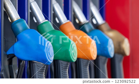 Fuel gasoline dispenser in gasoline station, Petrol pump filling nozzle at gasoline station fuel gasoline dispenser, Pistol pump gun fuel nozzle. Fuel gasoline dispenser in gasoline station, Petrol pump filling nozzle at gasoline station fuel gasoline dispenser, Pistol pump gun fuel nozzle. 123092522