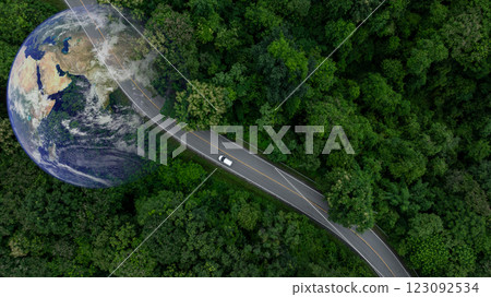 Aerial view EV electric vehicle car on middle green tree forest road globe earth planet, EV car electric vehicle car alternative sustainable energy eco power, Green business ecosystem environment. 123092534