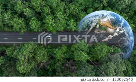 Aerial view EV electric vehicle car on middle green tree forest road globe earth planet, EV car electric vehicle car alternative sustainable energy eco power, Green business ecosystem environment. Aerial view EV electric vehicle car on middle green tree forest road globe earth planet, EV car electric vehicle car alternative sustainable energy eco power, Green business ecosystem environment. 123092540