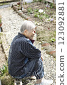 Old woman talking on a mobile phone 123092881