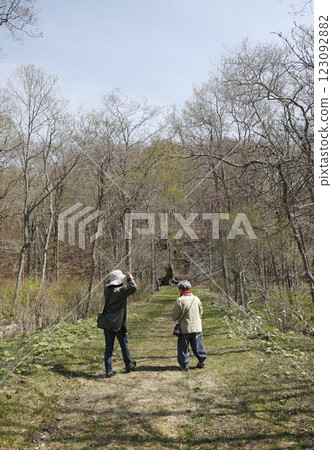 Senior woman walking in the mountains in spring Senior woman walking in the mountains in spring 123092882