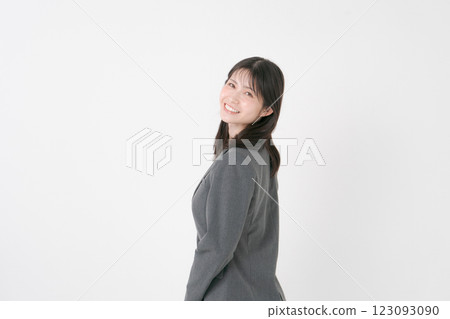 回顧的衣服的一名婦女 回顧的衣服的一名婦女 123093090