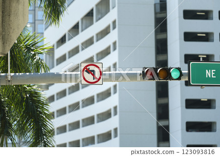 Traffic lights regulating driving cars on city street in Miami, Florida Traffic lights regulating driving cars on city street in Miami, Florida 123093816