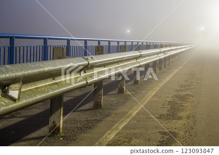 Thick fog over empty road at night 123093847