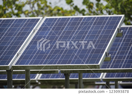 Solar photovoltaic panels mounted on stand-alone frame on backyard ground for generating of clean ecological electric energy. Concept of autonomous house 123093878