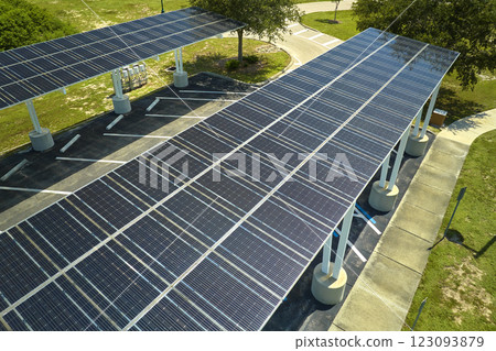 Solar panels installed over parking lot for parked cars for effective generation of clean energy 123093879