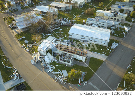 Severely damaged houses after hurricane Ian in Florida mobile home residential area. Consequences of natural disaster Severely damaged houses after hurricane Ian in Florida mobile home residential area. Consequences of natural disaster 123093922