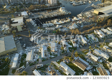 Severely damaged houses after hurricane Ian in Florida mobile home residential area. Consequences of natural disaster 123093923