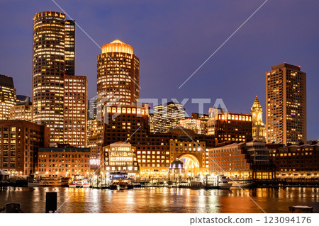 View of Boston downtown  skyscrapers seen from Fan Pier Park on a cold cloudy winter night 123094176