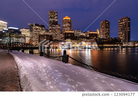 View of Boston downtown  skyscrapers seen from Fan Pier Park on a cold cloudy winter night 123094177