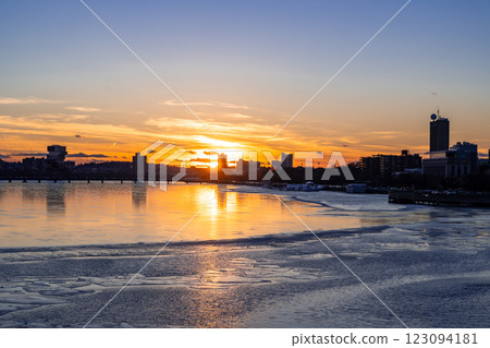 Silhouette view of Boston city skyline with high-rise buildings seen from Longfellow bridge over Charles river during winter sunset Silhouette view of Boston city skyline with high-rise buildings seen from Longfellow bridge over Charles river during winter sunset 123094181