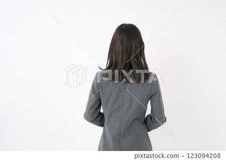 The back of a woman in a suit The back of a woman in a suit 123094208