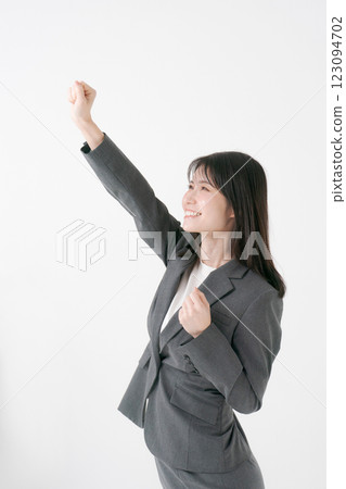 Business woman doing a fist pump Business woman doing a fist pump 123094702