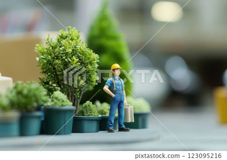 Miniature workers in work clothes standing on a street corner 123095216