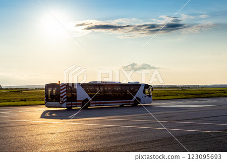 Airport shuttle bus in the evening light Airport shuttle bus in the evening light 123095693