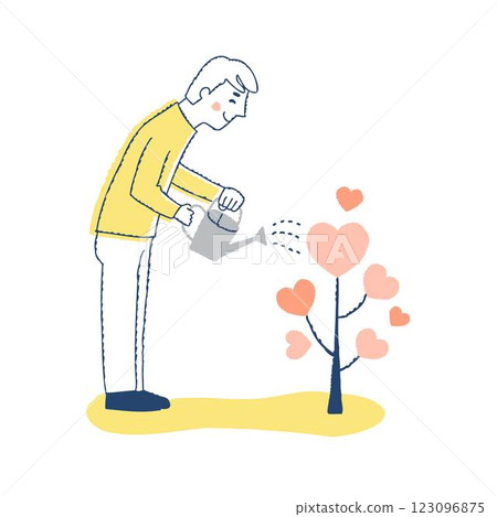 一名男子正在為心形樹澆水 123096875