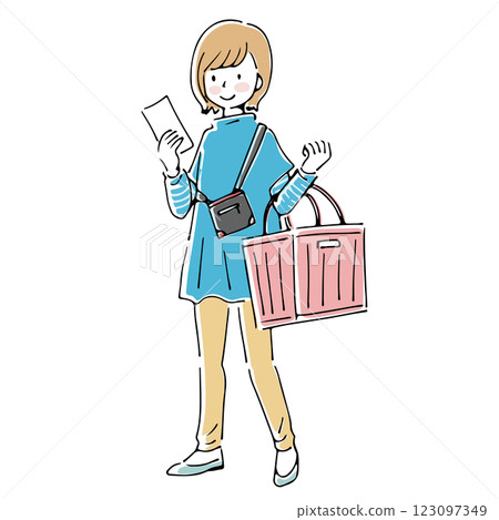 A woman shopping with a shopping basket while looking at her shopping list 123097349
