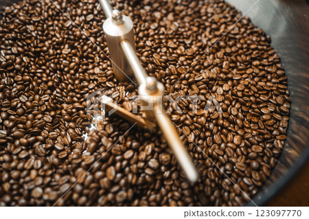 Coffee beans roasted in a coffee machine and coffee roasting 123097770