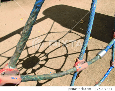 Shadow of playground equipment in the park 123097874