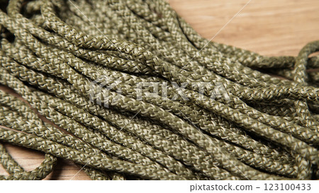 Background Nylon Cords. Rope, Polypropylene Cord. Green Olive Khaki colors. For Military Army, Sporting Events and Outdoor Activities. Background Nylon Cords. Rope, Polypropylene Cord. Green Olive Khaki colors. For Military Army, Sporting Events and Outdoor Activities. 123100433