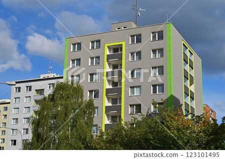 Original prefabricated houses on a housing estate from the communist era in Eastern and Central Europe after reconstruction.. Facade of a modern apartment building with windows and balconies. Czech 123101495