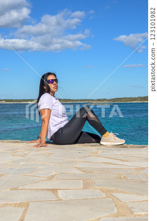 Latina Woman Relaxing on a Pier in Mallorca, Spain Latina Woman Relaxing on a Pier in Mallorca, Spain 123101982