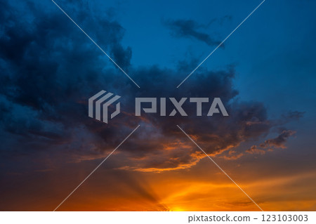 A breathtaking sunset over a vibrant sky filled 123103003