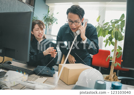 A boss apologizing over a complaint phone call A boss apologizing over a complaint phone call 123103040