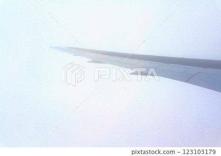 <Vehicles> Clouds and wings seen from an airplane window <Vehicles> Clouds and wings seen from an airplane window 123103179