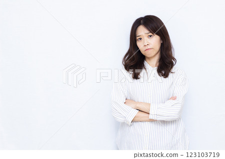 Angry woman with arms crossed Angry woman with arms crossed 123103719