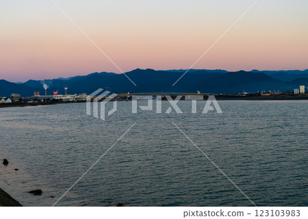 Scenery of Maekawa River and surrounding area with dusk in the background, Yatsushiro Port (Yatsushiro City) 123103983
